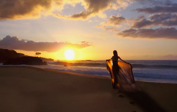 Walking on the beach at sunrise