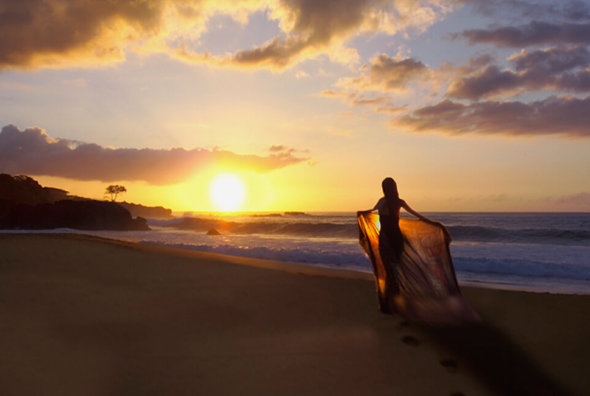 Walking on the beach at sunrise