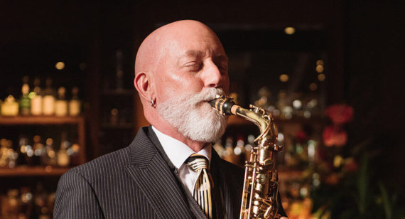 Rocky Holmes plays saxaphone at Lewers Lounge